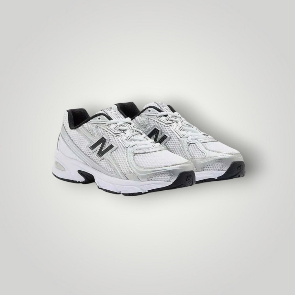 NDO Clothing New Balance 740 Sneaker in Weiss und Silber mit Mesh-Obermaterial, Schnürung und Abzorb-Dämpfung.