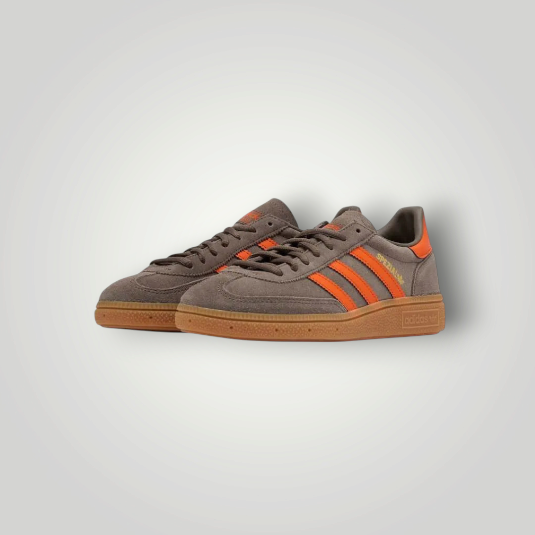 NDO Clothing Adidas Originals Handball Spezial Sneaker in Grau mit leuchtend orangen Streifen und Gummisohle