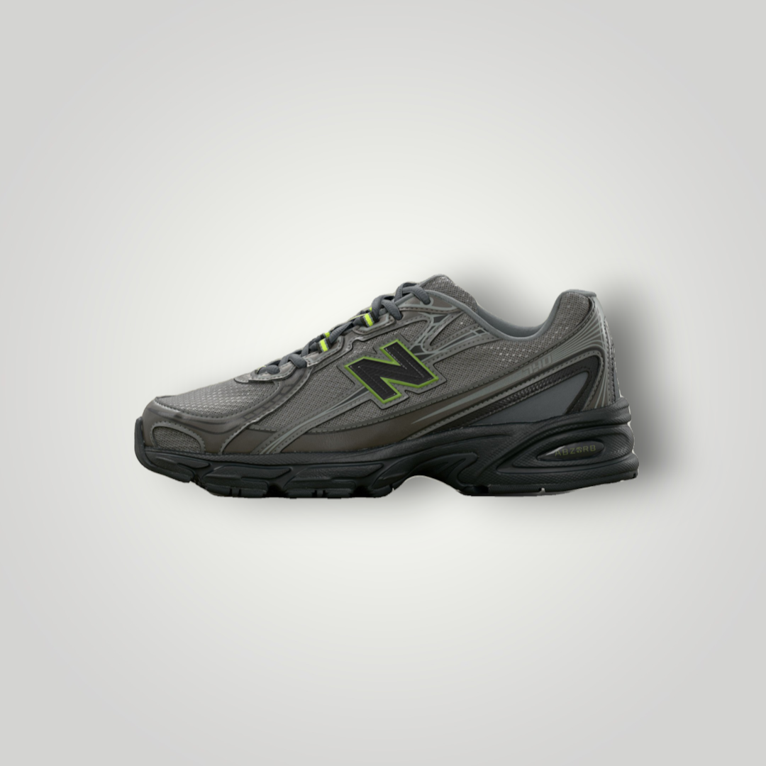 NDO Clothing New Balance 740 Sneaker in Schwarz und Metallic mit grünen Akzenten, Mesh-Obermaterial und Abzorb-Sohle.