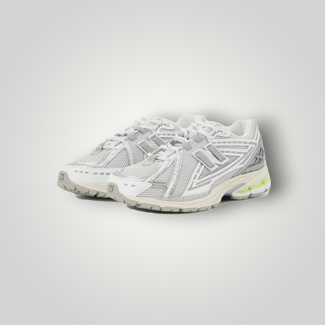 NDO Clothing New Balance U1906 Unisex Sneaker in Grau mit Mesh-Obermaterial und gelben Akzenten an der Sohle