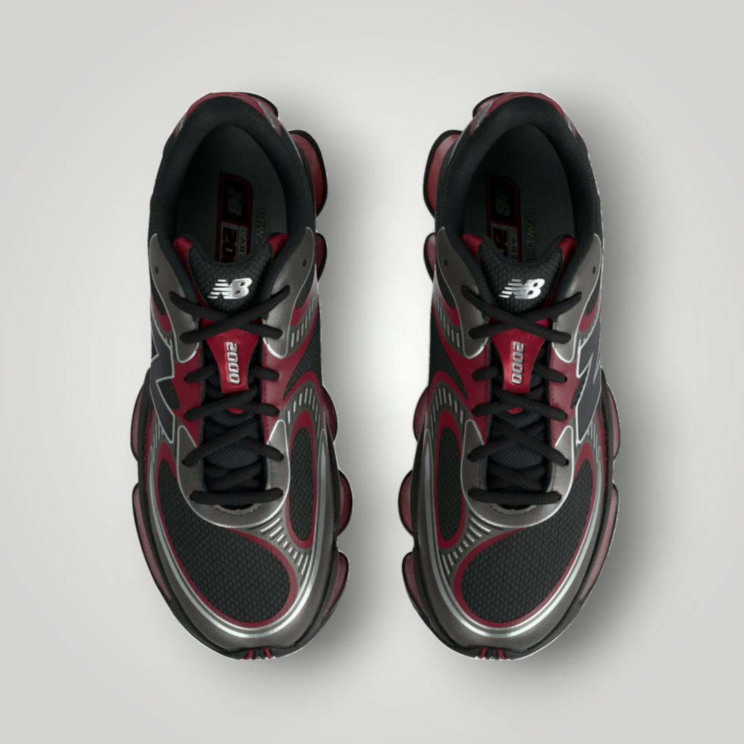 NDO Clothing New Balance U2000 Sneaker in Schwarz und Podium-Rot mit Mesh-Obermaterial und Schnürung in Draufsicht