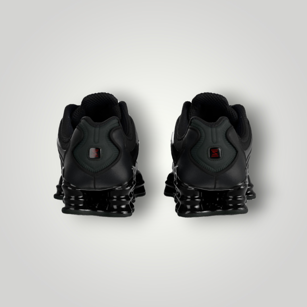 NDO Clothing Nike Shox TL Sneaker in Schwarz mit markanter 4-Säulen-Dämpfung und reflektierender Ferse, Rückansicht