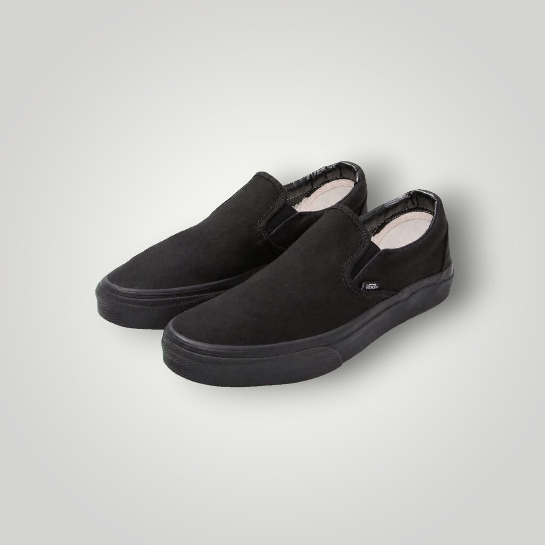 NDO Clothing Vans Classic Slip-On Sneaker aus schwarzem Canvas mit flacher Gummisohle und elastischen Einsätzen